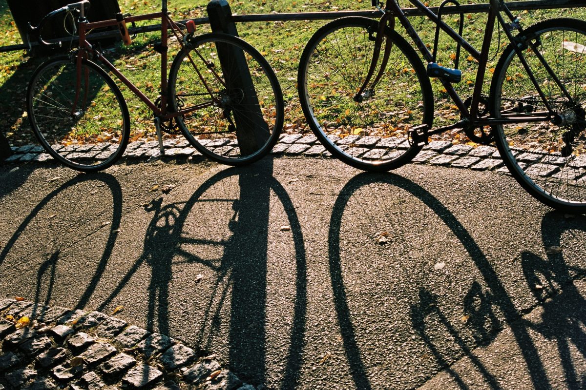 black metal fence on gray concrete pavement